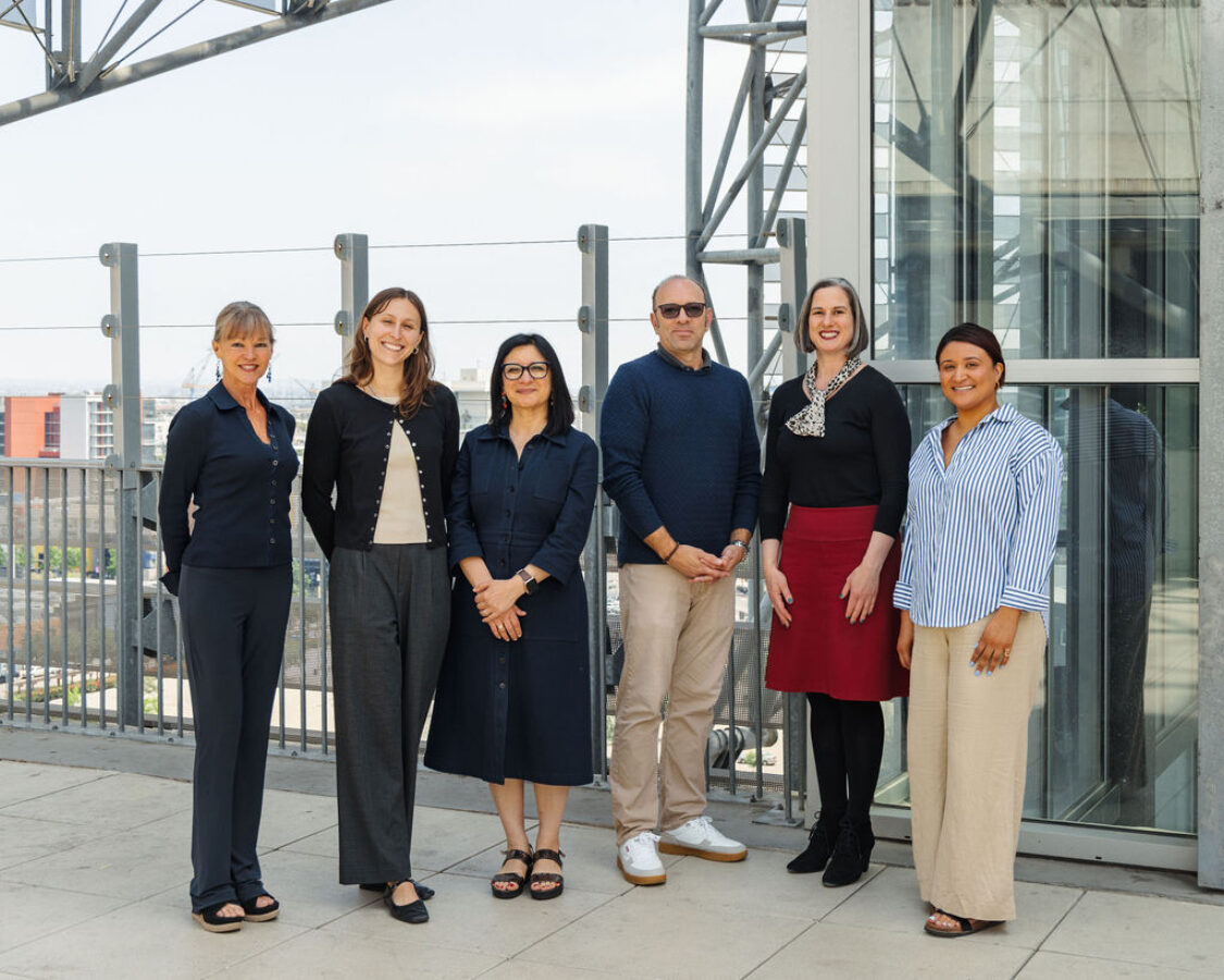 Library Foundation SD staff poses on top of the San Diego Central Library @ Joan Λ Irwin Jacobs Common with staff from the Carnegie Corporation of New York.