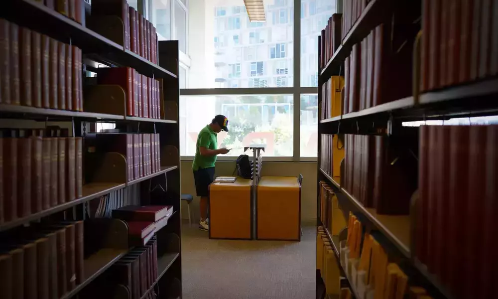 On Thursday, Aug. 25, 2022 at the San Diego Central Library, Joe Brady stood at his favorite desk located near the large library window with a view of the Coronado Bay Bridge.