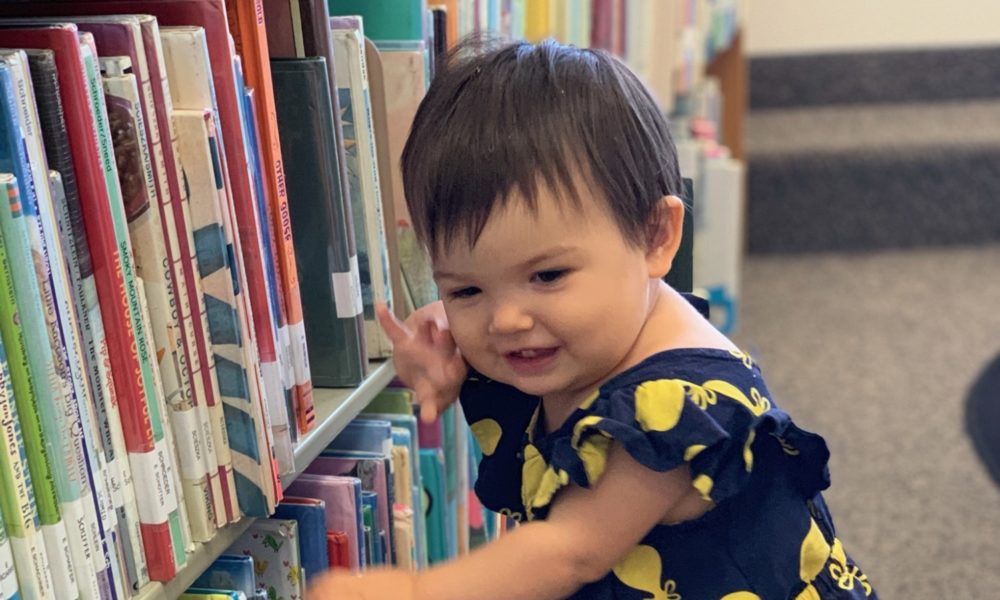 Ellie Blair picks a book.